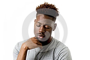 Young attractive afro american man on his 20s looking sad and depressed posing emotional