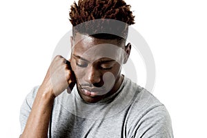 Young attractive afro american man on his 20s looking sad and depressed posing emotional