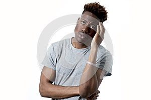 Young attractive afro american man on his 20s looking sad and depressed posing emotional