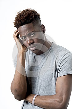 Young attractive afro american man on his 20s looking sad and depressed posing emotional