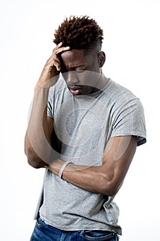 Young attractive afro american man on his 20s looking sad and depressed posing emotional