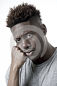 Young attractive afro american man on his 20s looking sad and depressed posing emotional