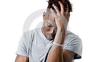 Young attractive afro american man on his 20s looking sad and depressed posing emotional photo