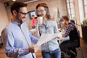 Young attractive architects discussing in modern office