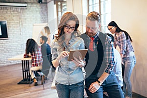 Young attractive architects discussing in modern office