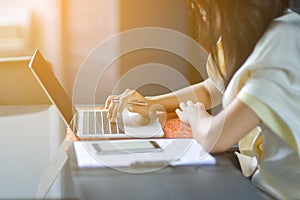 Young attractive Asian business woman sleeping, drowsing or taking a nap at her desk, Tired business woman accountant with bills