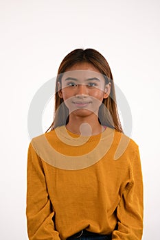 Young attractive asian girl smiling in studio