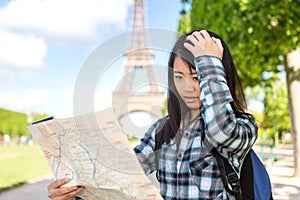 Young attractive asian tourist lost in Paris photo