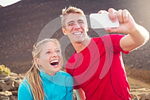 Young attractive athletic couple taking photo