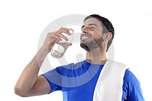 Young attractive and athletic sport man drinking water