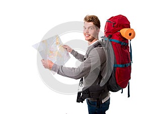 Young attractive backpacker tourist looking map carrying big backpack lugagge
