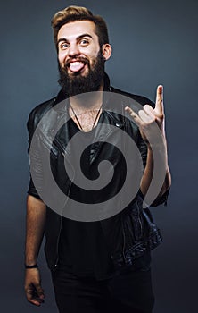 young attractive bearded hipster man gesturing emotional screami