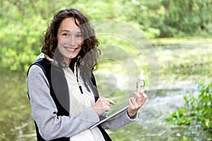 Young attractive biologist woman working on water analysis