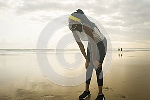 Young attractive black girl post quarantine jogging - new normal running workout of athletic and fit African American woman at