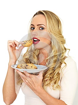 Young Attractive Blonde Haired Woman Eating Biscuits