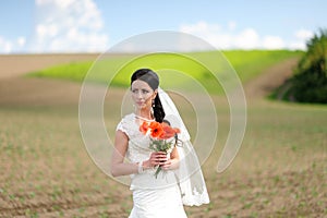 Young attractive bride with the bouquet