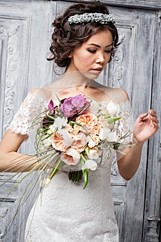 Young attractive bride with flowers
