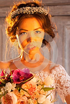 Young attractive bride with flowers
