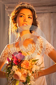 Young attractive bride with flowers