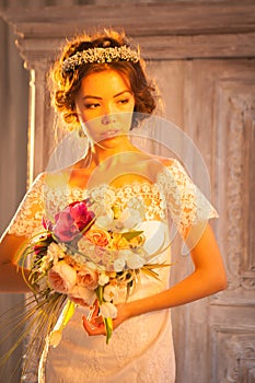 Young attractive bride with flowers