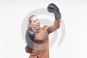 Young attractive business woman with boxing gloves