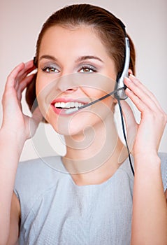 Young attractive business woman with headset