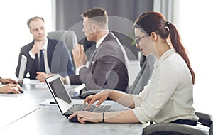 Young attractive business woman working in the office, developing her strategy