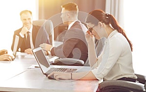 Young attractive business woman working in the office, developing her strategy