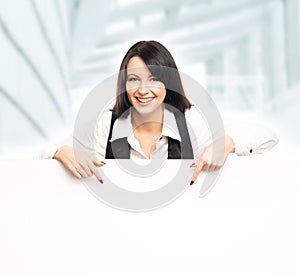 Young and attractive business woman working in office