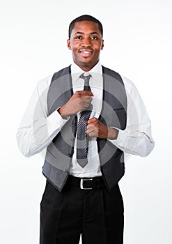 Young attractive businessman corrects a tie