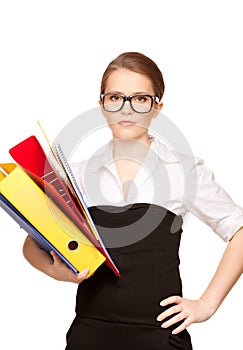 Young attractive businesswoman with folders