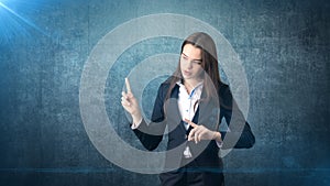 Young attractive businesswoman portrait in suit with standing and finger up, isolated studio background with copyspace.