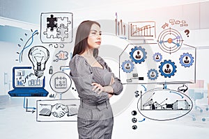 Young attractive businesswoman wearing grey dress is standing ne