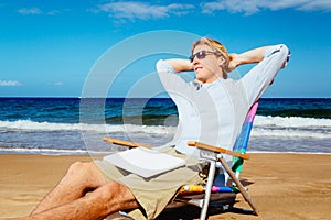 Young Attractive Casual Business Man Relaxing at the Beach with