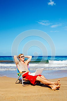 Young Attractive Casual Business Man Relaxing at the Beach with