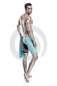 Young attractive caucasian man swimmer with goggles and towel