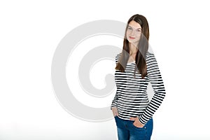Young attractive confident smiling girl, three quarter length portrait on white photo