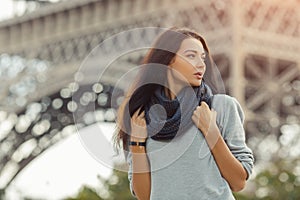 Young attractive confident woman Eiffel Tower in Paris, France