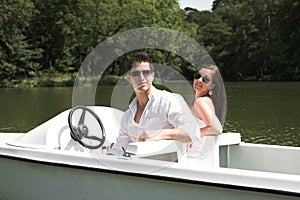 Young attractive couple on boat