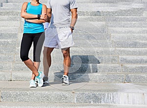 Young attractive couple exercising in stairs