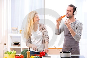 Young attractive couple having fun in the kitchen