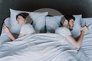 Young Attractive Couple Having Problem in Bed