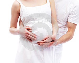 Young attractive couple: pregnant mother and father