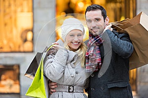 Young attractive couple with shopping bags