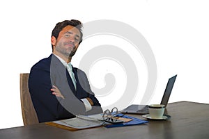 Young attractive and efficient business man working at office laptop computer desk confident in smiling happy in successful execut