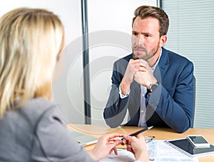 Young attractive employer doing a job interview to a woman