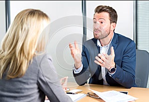 Young attractive employer doing a job interview to a woman