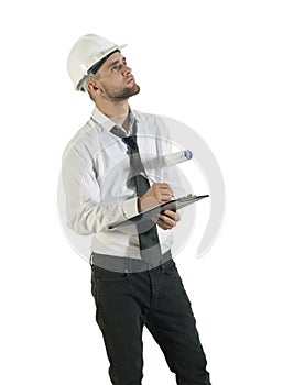 Young attractive engineer writing down notes on clipboard