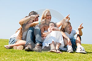 Young attractive family pointing