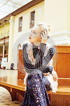 young attractive fashion lady on railway station waiting, vintag